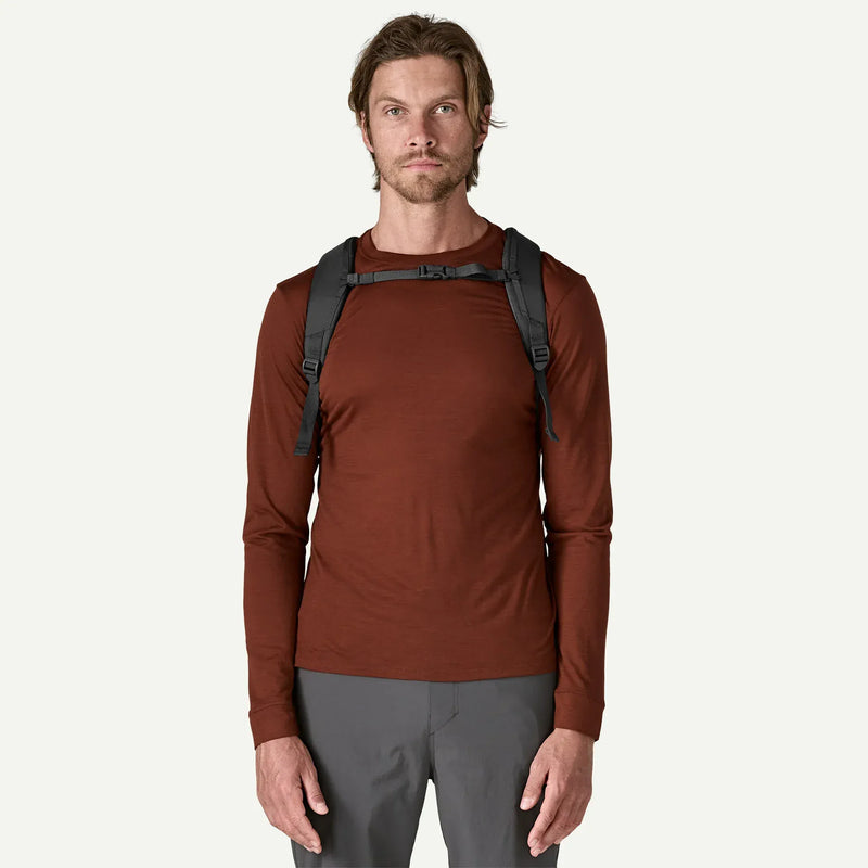 Load image into Gallery viewer, Man wearing a dark grey backpack on a white background
