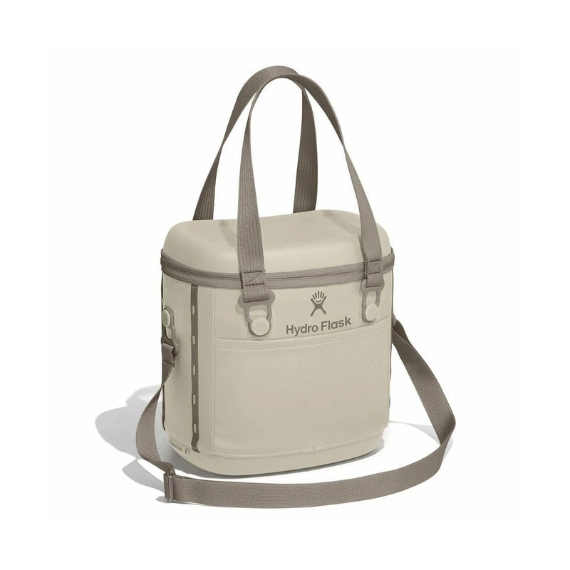 Load image into Gallery viewer, Beige cooler bag with shoulder strap on a white background, featuring Hydro Flask logo.
