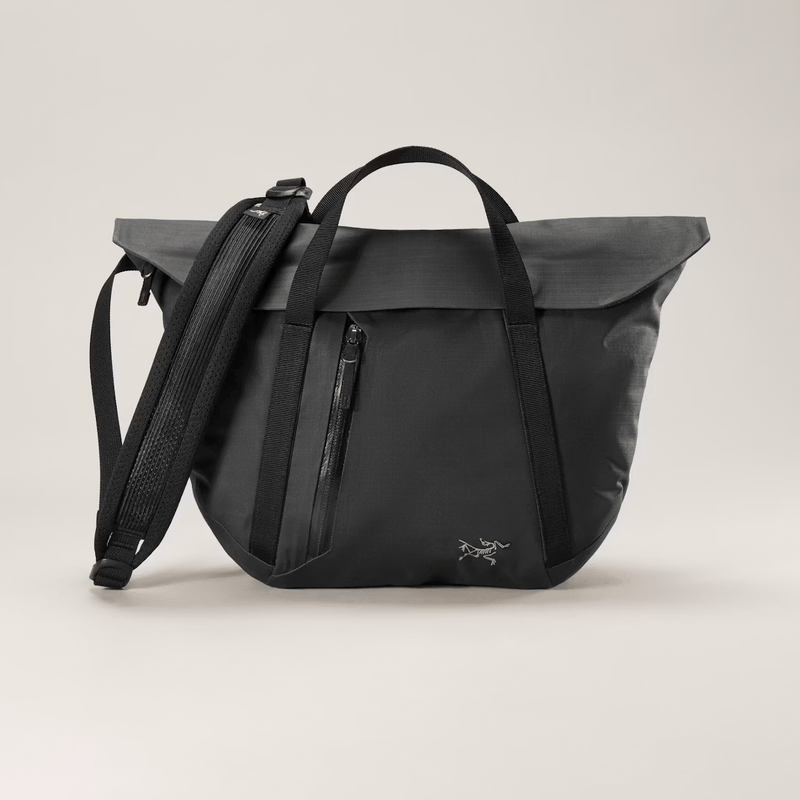 Load image into Gallery viewer, Black backpack with a visible brand logo on a light gray background
